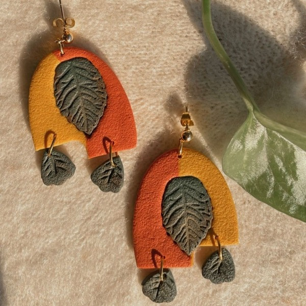 A Handmade Polymer Clay Earrings in the Shape of Autumn Leaves