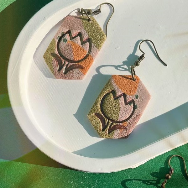 A Handmade Polymer Clay Earrings Engraved with a Tulip Flower